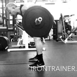 personal trainer demonstrating a bent over barbell row