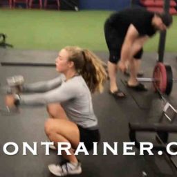 Fitness Trainer Performing Jump Squats
