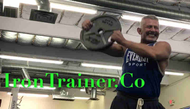 lateral Shoulder Swing exercise with an olympic plate