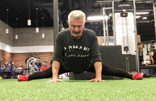 Personal Trainer demonstrating some carious dynamic Stretching techniques