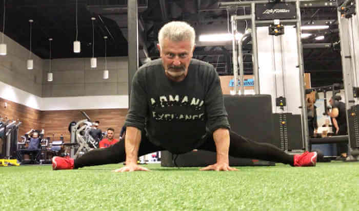 Personal Trainer demonstrating some carious dynamic Stretching techniques