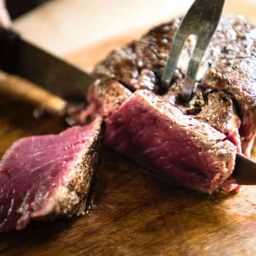 image of rare steak being sliced