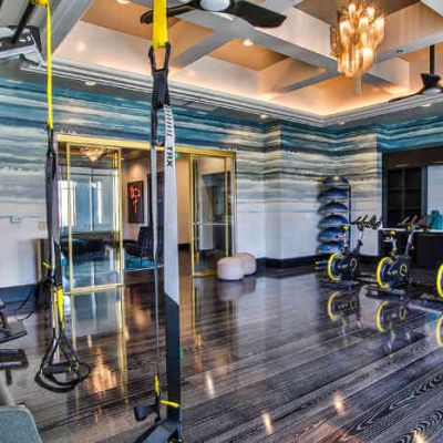 apartment gym with spinning bikes and TRX bands