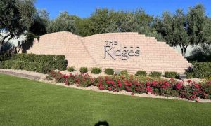 image of the ridges housing community entrance sign letters on a brick wall